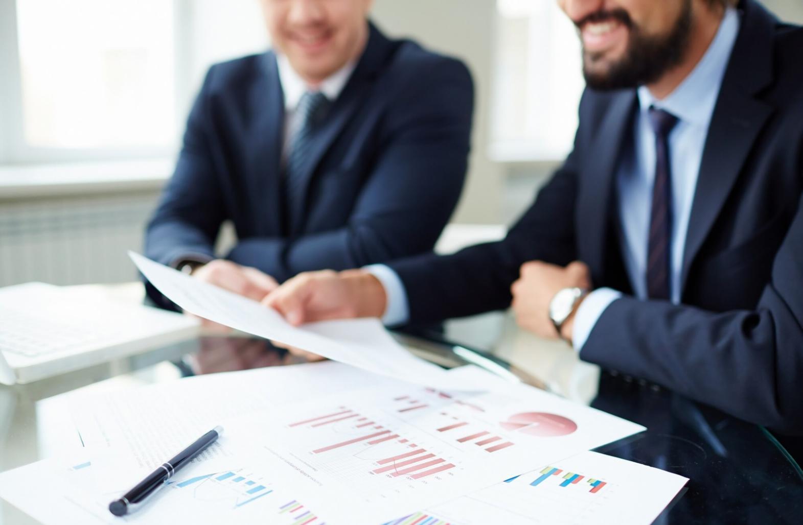 Professional video editing workstation with multiple monitors showing film editing software interface