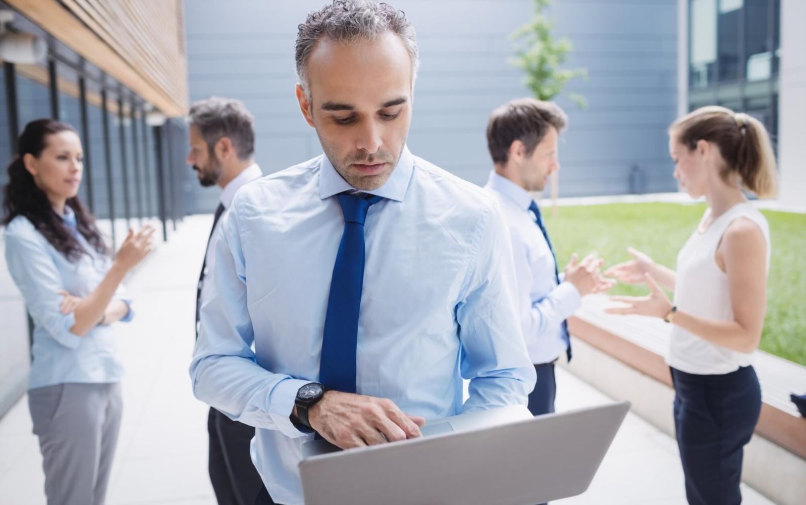 Professional film editing workspace with multiple monitors showing timeline and color correction tools